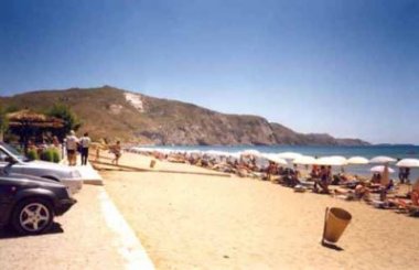 Illegal Kalamaki Beach Hotel Cafeteria showing leveled and concreted parking on the nesting beach. An unending line of beach furniture and tourists (24/07/01).